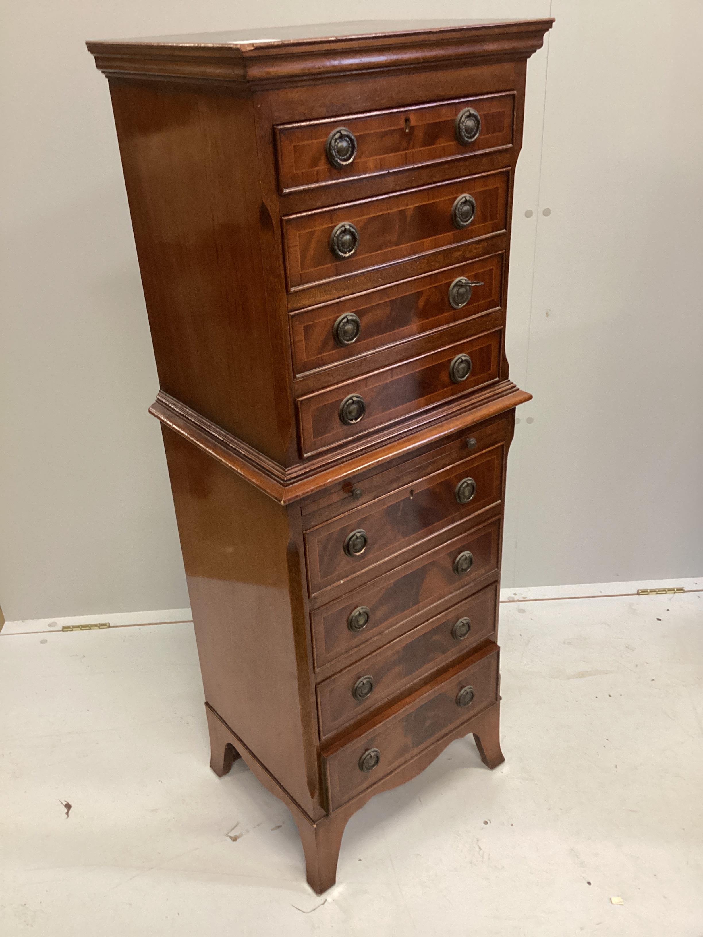 A reproduction mahogany narrow eight drawer chest with slide, width 44cm, depth 35cm, height 124cm